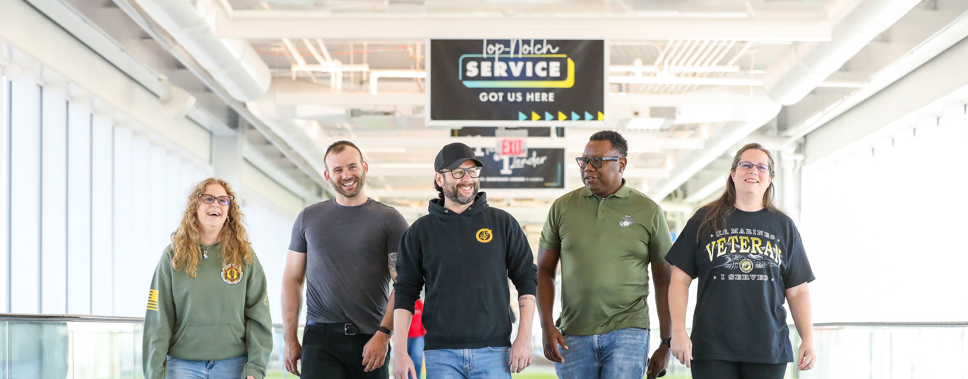 Landing page banner depicting several happy Veterans laughing together as UWM team members